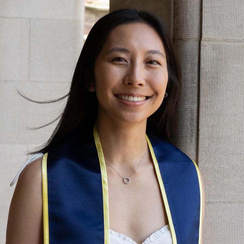 headshot of Kaylee smiling in front of gray background